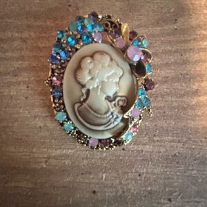 Elegant Cameo Brooch with Blue and Purple Accents